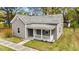 Charming home with vinyl siding, shingled roof, and welcoming front porch at 312 E Highland Ave, Rocky Mount, NC 27801