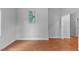 Living room featuring wood flooring, neutral walls, and natural light at 312 E Highland Ave, Rocky Mount, NC 27801