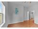 A living room features laminate floors, and natural light from the window at 312 E Highland Ave, Rocky Mount, NC 27801