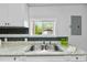 Kitchen sink with granite countertops and garden view at 312 E Highland Ave, Rocky Mount, NC 27801