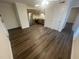Open-concept living room and kitchen features modern floors, appliances, and fixtures at 3533 Ivy Commons Dr # 301, Raleigh, NC 27606