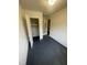 A room featuring a closet, a door to the outside, and painted floors at 3533 Ivy Commons Dr # 301, Raleigh, NC 27606