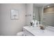 Well-lit bathroom with a stylish vanity, mirror, and coordinated decor at 355 Fosterton Cottage Way, Raleigh, NC 27603