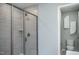 Contemporary bathroom showcasing a tiled shower with glass door and a separate toilet room at 355 Fosterton Cottage Way, Raleigh, NC 27603