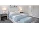 Stylishly decorated bedroom with a large, comfortable bed, neutral tones, and an inviting atmosphere at 355 Fosterton Cottage Way, Raleigh, NC 27603