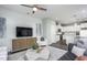 Open-concept layout showcasing the living room that flows into the kitchen, complete with stylish decor and ample lighting at 355 Fosterton Cottage Way, Raleigh, NC 27603