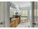 This charming bathroom features double sinks, granite counters, a soaking tub, and natural light at 363 Dublin Dr, Sanford, NC 27330