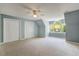 Spacious carpeted bedroom with ample closet space and a large window for natural light at 363 Dublin Dr, Sanford, NC 27330