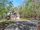Two-story brick home with a two-car garage, set among mature trees and a spacious yard at 363 Dublin Dr, Sanford, NC 27330
