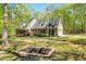 Beautiful brick home with an American flag and a manicured lawn surrounded by trees at 363 Dublin Dr, Sanford, NC 27330