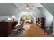 Well-lit home office with a hardwood floor, a desk, and a bookshelf at 363 Dublin Dr, Sanford, NC 27330