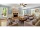 Bright and spacious living room with a fireplace, hardwood floors, and ample seating at 363 Dublin Dr, Sanford, NC 27330