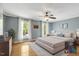 Spacious main bedroom boasts light-filled windows and neutral tones, offering a relaxing retreat at 363 Dublin Dr, Sanford, NC 27330