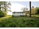 Picture of the back of the house and the spacious backyard with plenty of nature around it at 3728 Gideon Dr, Wake Forest, NC 27587