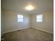 This bedroom has neutral walls, carpeted floors, and two windows for natural light at 3728 Gideon Dr, Wake Forest, NC 27587