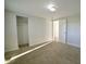 A bedroom with neutral carpeting, ample closet space, and a light fixture at 3728 Gideon Dr, Wake Forest, NC 27587