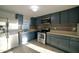 Modern kitchen with stainless steel appliances, updated cabinets, and stylish backsplash at 3728 Gideon Dr, Wake Forest, NC 27587