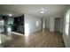Open-concept living space with wood floors connecting the living room to the kitchen at 3728 Gideon Dr, Wake Forest, NC 27587