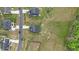 Drone shot of residential neighborhood showing house rooftops and green lawns at 396 Martins Mill Ct, Wendell, NC 27591