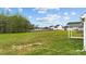 Large backyard with green lawn, perfect for outdoor activities, with partial view of the covered patio at 396 Martins Mill Ct, Wendell, NC 27591