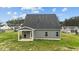 Expansive backyard featuring a covered patio, ideal for outdoor gatherings and relaxation at 396 Martins Mill Ct, Wendell, NC 27591