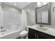 This bathroom features a tub and shower combo, single vanity and updated fixtures at 396 Martins Mill Ct, Wendell, NC 27591