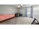 Bedroom with carpet, a ceiling fan, and a window with curtains, offering a comfortable and bright space at 396 Martins Mill Ct, Wendell, NC 27591
