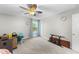 Bedroom with carpet, a ceiling fan, and a window with curtains, offering a comfortable and bright space at 396 Martins Mill Ct, Wendell, NC 27591