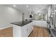 Open concept kitchen with a large island, modern appliances, and seamless access to the living area at 396 Martins Mill Ct, Wendell, NC 27591