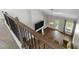 View of the living room from the second story, featuring hardwood floors and a fireplace at 396 Martins Mill Ct, Wendell, NC 27591