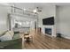 Inviting living room with soaring ceilings, fireplace, and open access to the modern kitchen at 396 Martins Mill Ct, Wendell, NC 27591