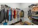 This walk-in closet provides ample storage with shelving and hanging options at 396 Martins Mill Ct, Wendell, NC 27591