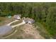 Aerial view showcases a home with a spacious yard and mature trees, highlighting its attractive setting at 40 Patricia S Vann Ct, Dunn, NC 28334