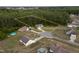 An aerial view of homes highlighting the large lot nestled amongst mature trees at 40 Patricia S Vann Ct, Dunn, NC 28334