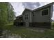 Back exterior of home showcasing siding, a deck, and yard at 40 Patricia S Vann Ct, Dunn, NC 28334