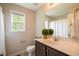 Well-lit bathroom features vanity with sink, toilet, and combination shower and tub at 40 Patricia S Vann Ct, Dunn, NC 28334