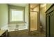 Bright bathroom featuring a bathtub, separate shower, and vanity at 40 Patricia S Vann Ct, Dunn, NC 28334