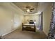 Carpeted bedroom with a ceiling fan, decorative ceiling, and ample natural light at 40 Patricia S Vann Ct, Dunn, NC 28334