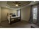 Bedroom with a decorative ceiling, fan, carpet, and windows with coverings at 40 Patricia S Vann Ct, Dunn, NC 28334