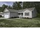 Charming one-story home featuring manicured lawn, attached garage, and traditional siding at 40 Patricia S Vann Ct, Dunn, NC 28334