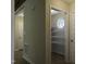 Hallway with pantry featuring shelving and decorative window for extra storage at 40 Patricia S Vann Ct, Dunn, NC 28334