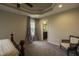 Spacious main bedroom features trey ceiling, ceiling fan, plush carpet, and bathroom entrance at 40 Patricia S Vann Ct, Dunn, NC 28334