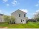 Home's backyard features a well-maintained lawn, lush greenery, and a private, fenced-in space at 400 Collington Dr, Mebane, NC 27302