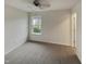 Bedroom featuring carpet floors, neutral walls, ceiling fan, and an outdoor view from a single window at 400 Collington Dr, Mebane, NC 27302
