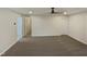 Spacious bonus room featuring neutral walls, carpet floors, ceiling fan, and multiple doorways at 400 Collington Dr, Mebane, NC 27302