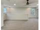 Large bonus room area featuring carpet floors, neutral walls, and windows with bright outdoor views at 400 Collington Dr, Mebane, NC 27302