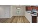 Cozy dining area illuminated by a modern light fixture, adjacent to the kitchen, great for Gathering meals at 400 Collington Dr, Mebane, NC 27302