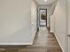Entryway featuring wood-look floors, white trim and walls, and a view to the outdoors through a glass door at 400 Collington Dr, Mebane, NC 27302