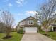 Charming two-story home featuring a two-car garage, manicured lawn, and inviting curb appeal at 400 Collington Dr, Mebane, NC 27302