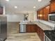 Modern kitchen with granite countertops, stainless steel appliances, and ample cabinet space for storage at 400 Collington Dr, Mebane, NC 27302